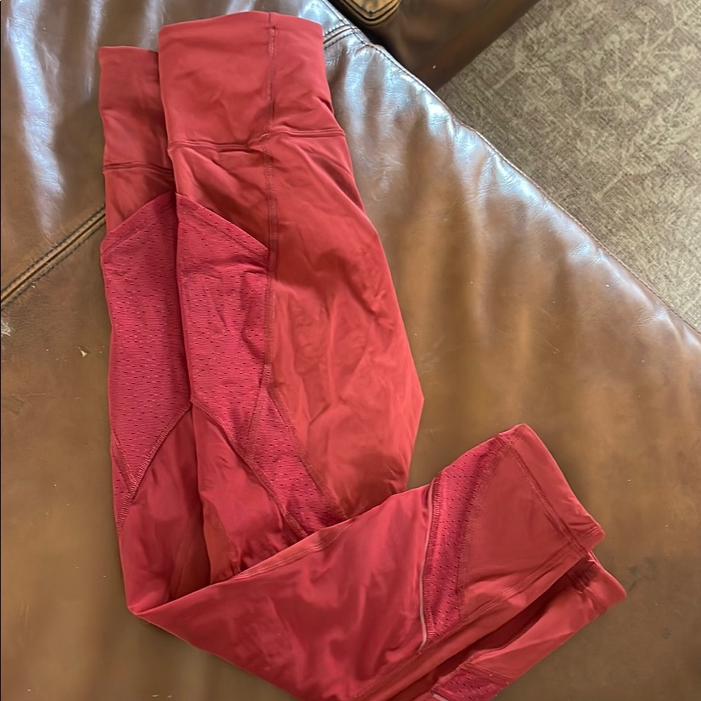 Dark red Lululemon Capri leggings with mesh
